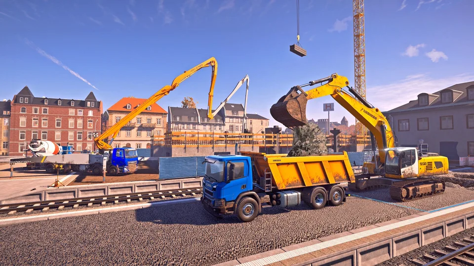 An excavator loading a dump truck at a European construction site with a concrete pump, mixer truck and tower crane in Construction Simulator